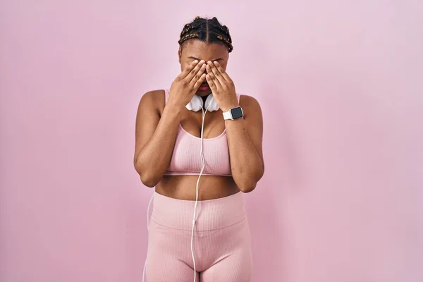 African American Woman Braids Wearing Sportswear Headphones Rubbing Eyes Fatigue —  Fotos de Stock