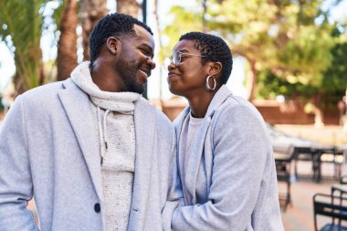 Man and woman couple smiling confident standing together at park