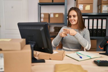 Young blonde woman ecommerce business worker having online deaf language conversation at office