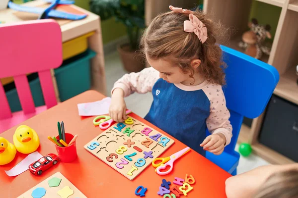 Adorable Blonde Girl Playing Maths Puzzle Game Sitting Table Kindergarten — Stockfoto