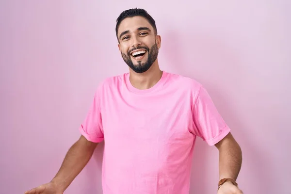 Hispanic Young Man Standing Pink Background Smiling Cheerful Open Arms — Stock fotografie
