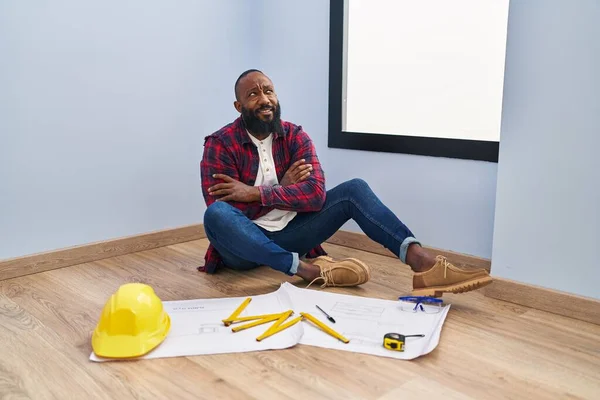 African American Man Sitting Floor New Home Looking Blueprints Smiling — Foto de Stock