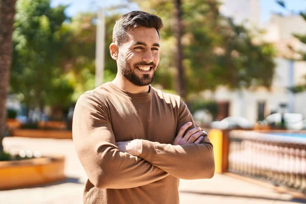 Young Hispanic Man Smiling Confident Standing Arms Crossed Gesture Park — Stok fotoğraf
