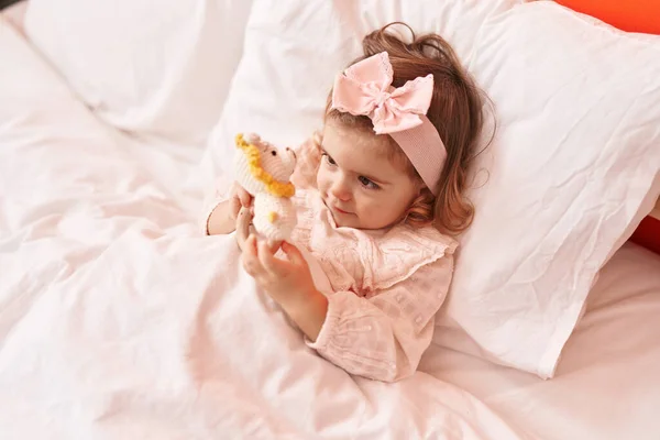 Adorable Blonde Toddler Playing Toys Lying Bed Bedroom — Stock Photo, Image