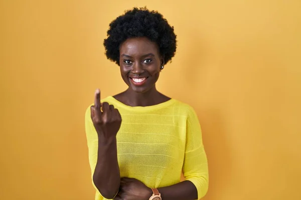 African Young Woman Standing Yellow Studio Beckoning Come Here Gesture — Foto de Stock