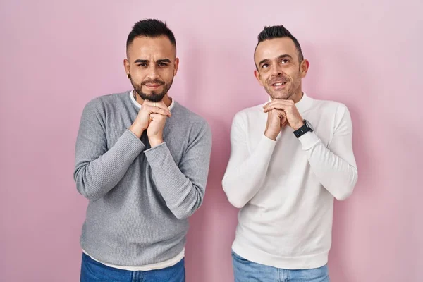 Homosexual Couple Standing Pink Background Laughing Nervous Excited Hands Chin — Stok fotoğraf