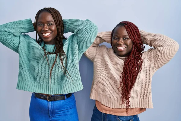 Two African Woman Standing Blue Background Relaxing Stretching Arms Hands — ストック写真