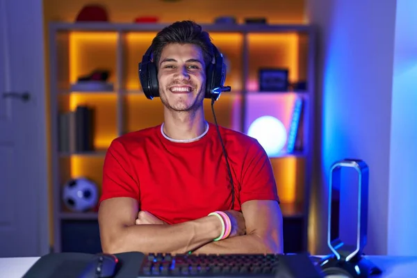 Young Hispanic Man Playing Video Games Happy Face Smiling Crossed — Stockfoto