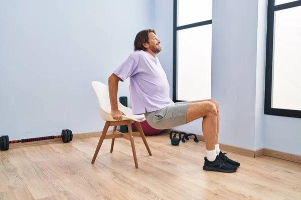 Middle Age Man Smiling Confident Sitting Chair Stretching Sport Center — Stock Photo, Image