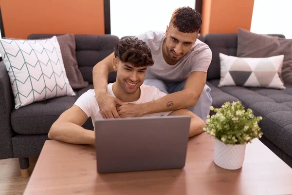 Two Hispanic Men Couple Using Laptop Sitting Sofa Home — Stock Photo, Image