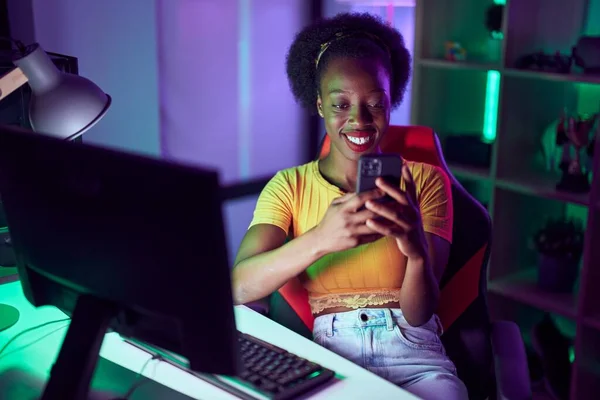 African American Woman Streamer Smiling Confident Using Smartphone Gaming Room — Photo