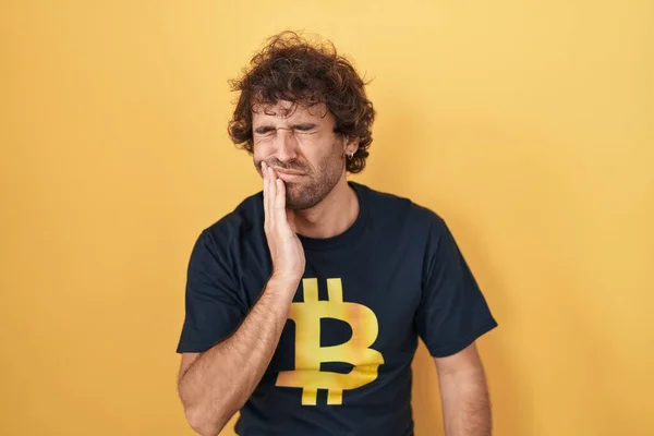 Hispanic Young Man Wearing Bitcoin Shirt Touching Mouth Hand Painful — Foto de Stock
