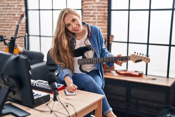 Young Blonde Woman Musician Composing Song Playing Electrical Guitar Music — Fotografia de Stock