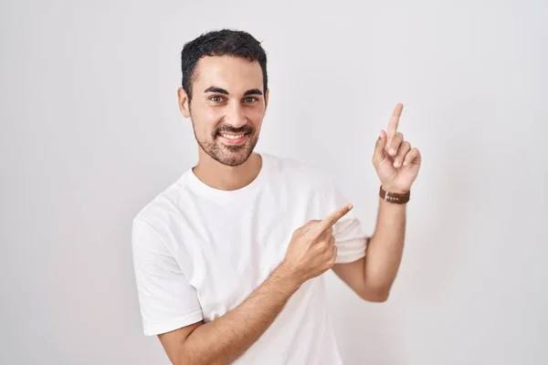Handsome Hispanic Man Standing White Background Smiling Looking Camera Pointing — 图库照片