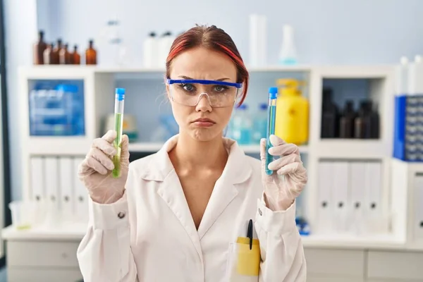 Young Caucasian Woman Working Scientist Laboratory Holding Samples Depressed Worry — Stockfoto