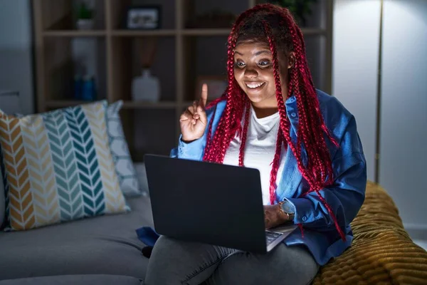 African American Woman Braided Hair Using Computer Laptop Night Pointing —  Fotos de Stock