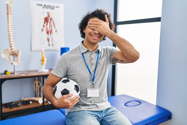 Hispanic Man Curly Hair Working Football Physiotherapist Smiling Laughing Hand — Stockfoto