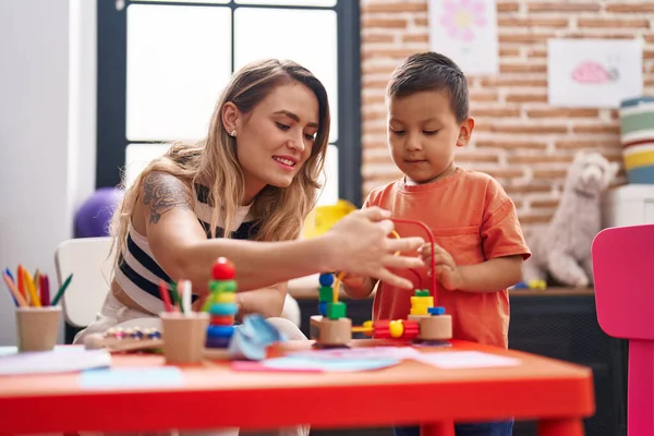 Teacher Toddler Playing Toys Sitting Table Kindergarten — Stock Fotó
