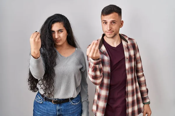 Young Hispanic Couple Standing White Background Doing Italian Gesture Hand — Stockfoto