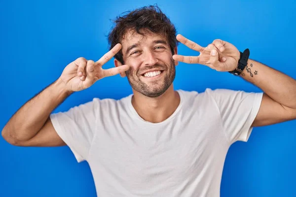 Hispanic Young Man Standing Blue Background Doing Peace Symbol Fingers — Stock Photo, Image