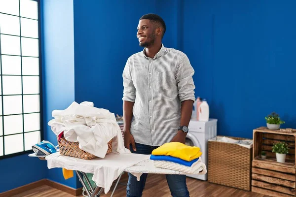 African American Man Ironing Clothes Home Looking Side Relax Profile — Stockfoto