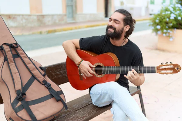 Young Hispanic Man Musician Playing Classical Guitar Sitting Bench Park — Fotografia de Stock