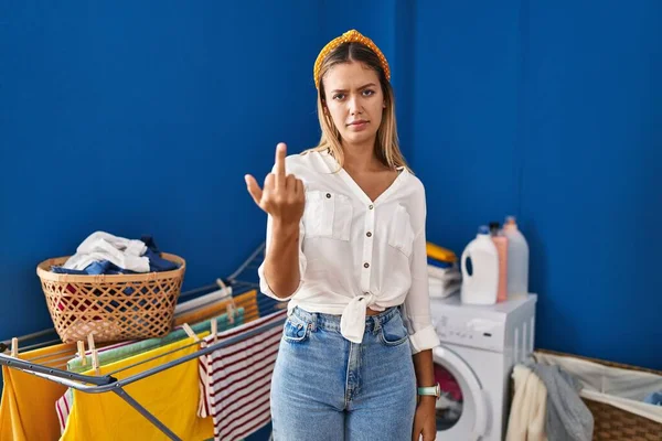 Young Blonde Woman Laundry Room Showing Middle Finger Impolite Rude — Stockfoto