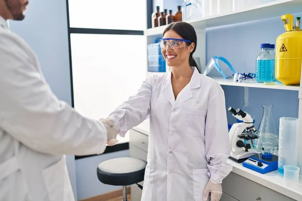 Man Woman Scientist Partners Smiling Confident Shake Hands Laboratory — Stockfoto