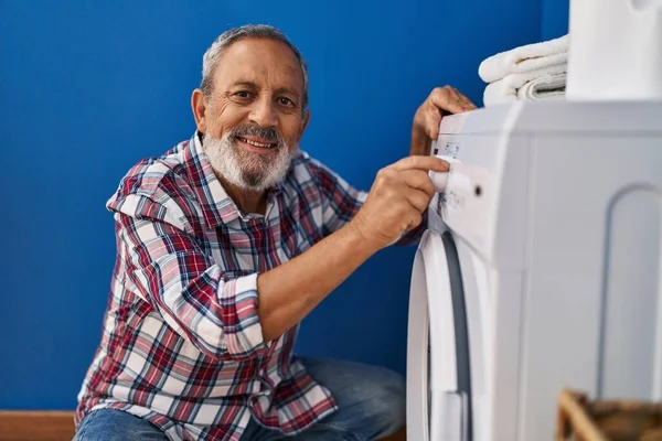 Senior Grey Haired Man Smiling Confident Turning Washing Machine Laundry — Stock Photo, Image