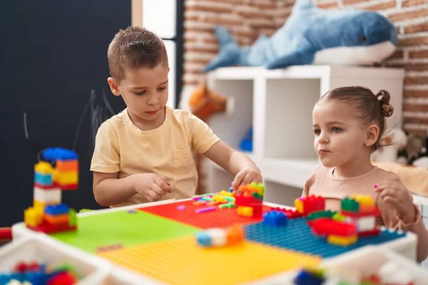 Two Kids Playing Construction Blocks Sitting Table Kindergarten — 图库照片