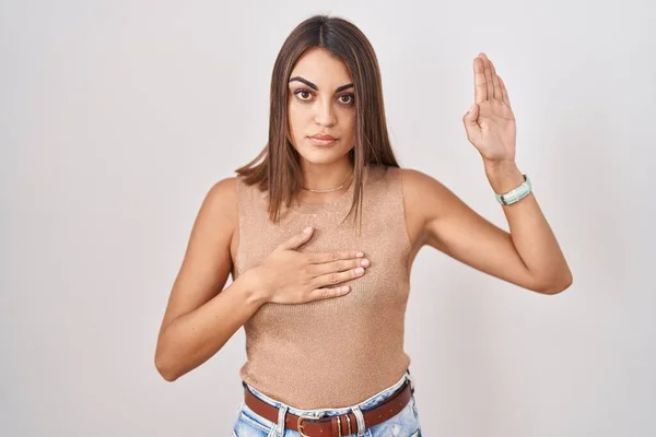 Young Hispanic Woman Standing White Background Swearing Hand Chest Open — Stockfoto