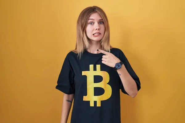 Blonde Caucasian Woman Wearing Bitcoin Shirt Pointing Aside Worried Nervous — Zdjęcie stockowe