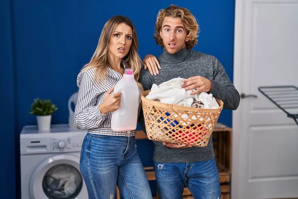 Couple Holding Laundry Basket Detergent Bottle Clueless Confused Expression Doubt — Stok fotoğraf