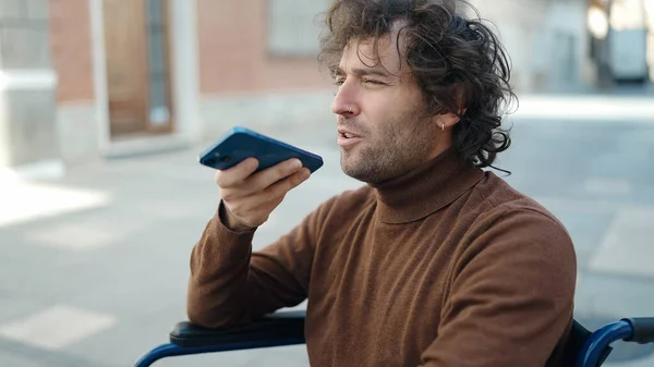Young Hispanic Man Talking Smartphone Sitting Wheelchair Street — Stok fotoğraf