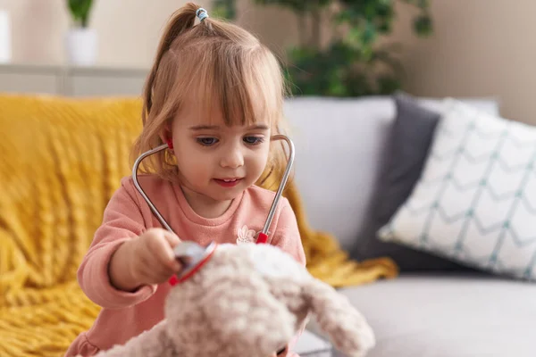 Adorable Blonde Girl Playing Doctor Examining Teddy Bear Stethoscope Home — 图库照片