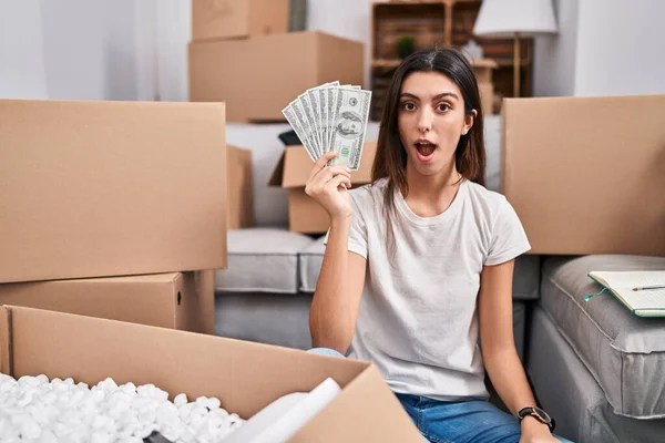 Young Beautiful Woman Sitting Floor New Home Holding Money Scared — Stockfoto