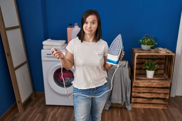 Hispanic Girl Syndrome Ironing Clothes Home Smiling Looking Side Staring — Fotografia de Stock