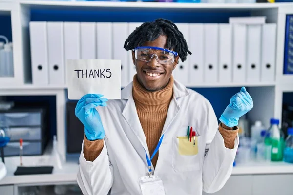 Young African Man Dreadlocks Working Scientist Laboratory Screaming Proud Celebrating — Fotografia de Stock