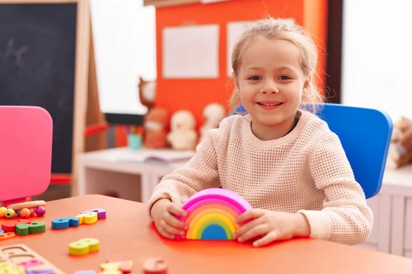 Adorable Blonde Girl Playing Toys Sitting Table Kindergarten — Stok fotoğraf