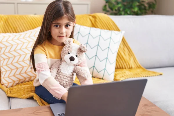 Adorable Hispanic Girl Using Laptop Sitting Sofa Home — Stok fotoğraf