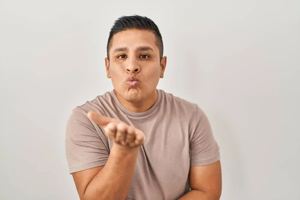 Hispanic Young Man Standing White Background Looking Camera Blowing Kiss — Stock fotografie