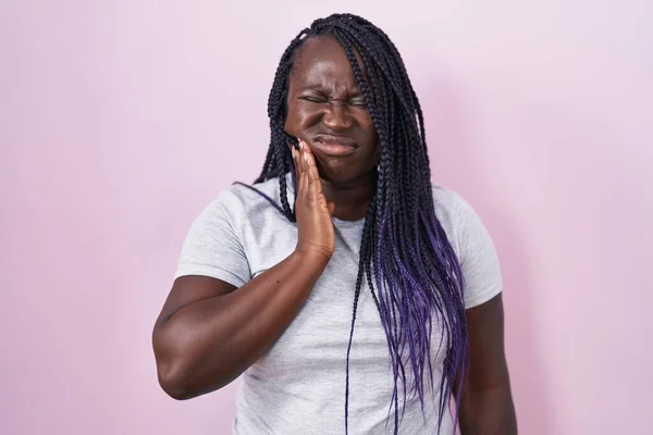 Young African Woman Standing Pink Background Touching Mouth Hand Painful — Stockfoto
