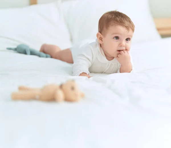 Adorable Toddler Lying Bed Teddy Bear Serious Expression Bedroom — Stock Photo, Image