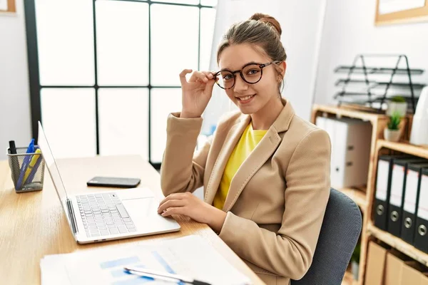 Adorable girl business worker using laptop working at office