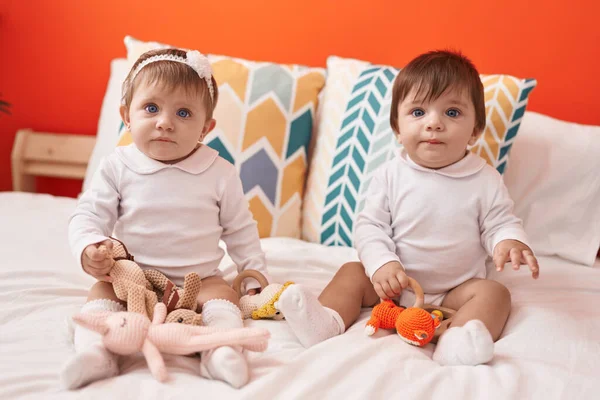 Two Adorable Babies Holding Toy Sitting Bed Bedroom — Stock Photo, Image