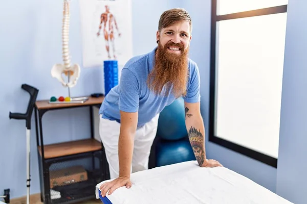 Young Redhead Man Wearing Physiotherapist Uniform Standing Physiotherapy Clinic — Stockfoto