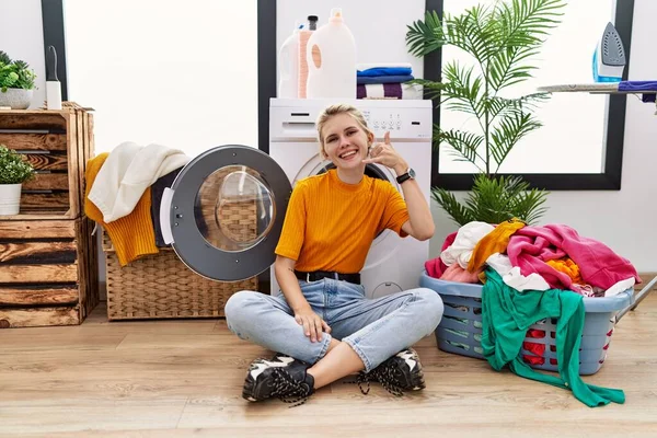 Young Blonde Woman Doing Laundry Sitting Washing Machine Smiling Doing — Fotografia de Stock