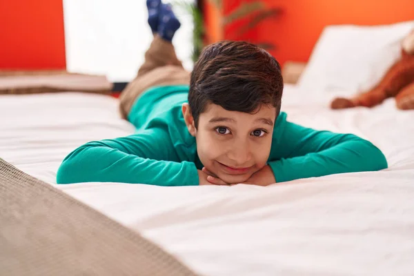 Adorable Hispanic Boy Smiling Confident Lying Bed Bedroom — Stock Photo, Image