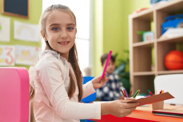 Adorable Hispanic Girl Smiling Confident Sitting Table Kindergarten — Stockfoto