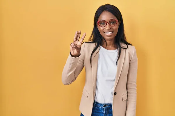 African Young Woman Wearing Glasses Showing Pointing Fingers Number Three — Stock Photo, Image